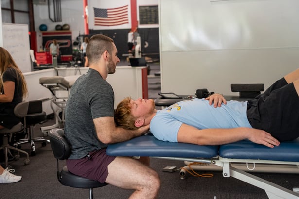 Patient working with a provider at a performance physical therapy clinic in Hudson, MA