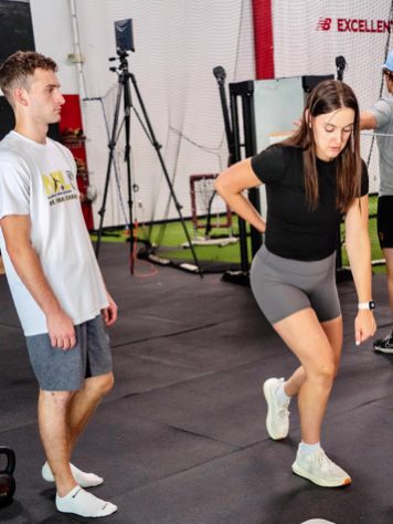 Physical therapist providing one-on-one running gait analysis and strength training at Hudson Massachusetts clinic Physical therapist providing one-on-one running gait analysis and strength training at Hudson Massachusetts clinic